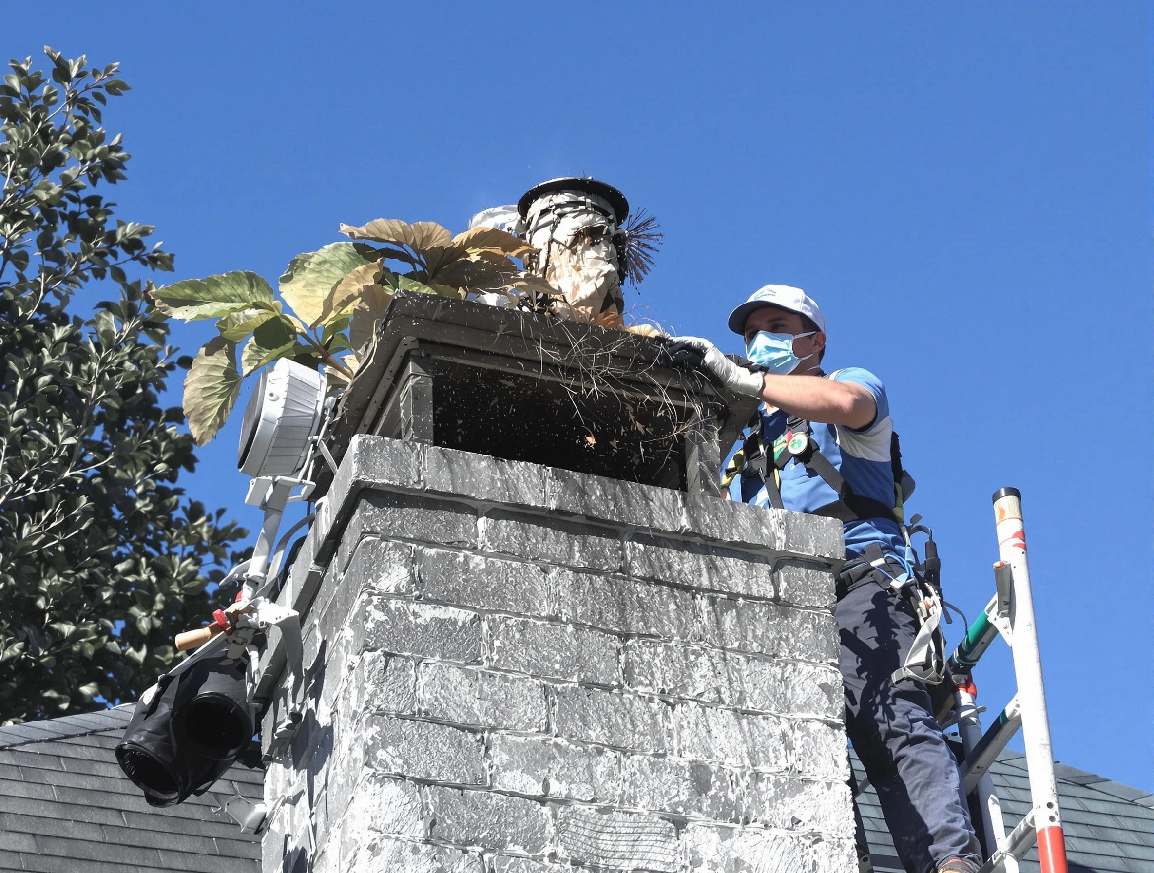 Wall Chimney Sweep specialist performing chimney cleaning in Wall, NJ